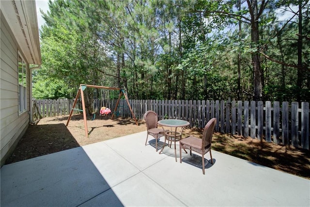 1575 Parkside Village Dr, Cumming, GA 30040 - fenced backyard with a patio and a playground