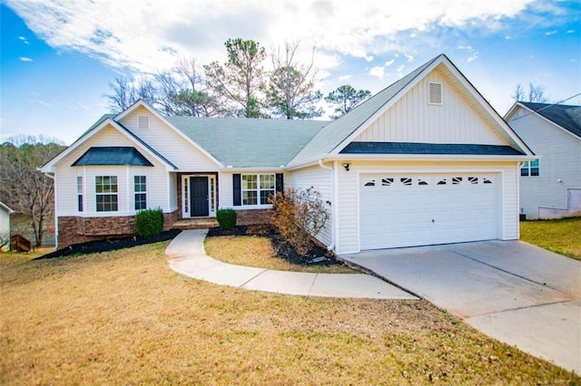 view of front of house featuring driveway, an attached garage, a front yard, and board and batten siding