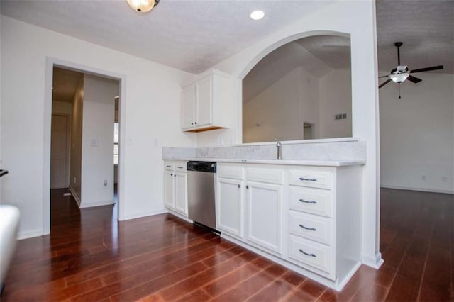 kitchen featuring dishwasher, light countertops, dark wood-style floors, and a sink