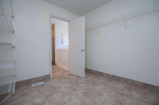 spacious closet with visible vents