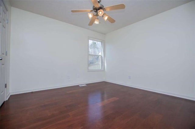 unfurnished room with ceiling fan, baseboards, and wood finished floors