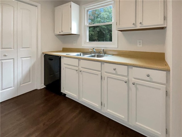 kitchen featuring sink, dark hardwood / wood-style flooring, dishwasher, and white cabinets