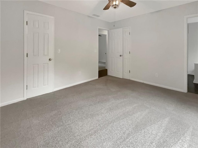 unfurnished bedroom with carpet floors and ceiling fan