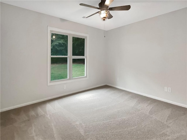 carpeted empty room with ceiling fan