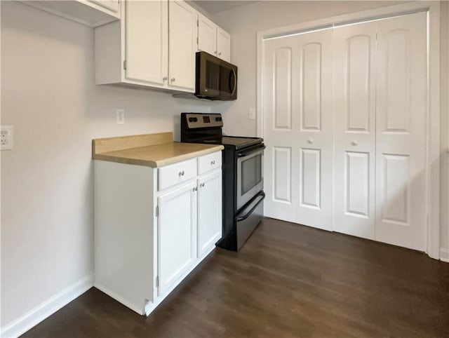 kitchen with white cabinetry, black range with electric stovetop, and dark hardwood / wood-style flooring