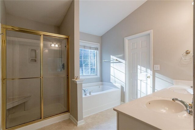 bathroom with tile patterned floors, vanity, lofted ceiling, and plus walk in shower