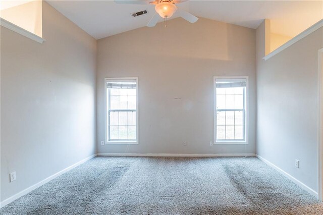 unfurnished room with carpet floors, plenty of natural light, and ceiling fan