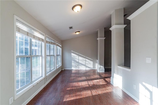 hallway featuring vaulted ceiling and dark hardwood / wood-style floors