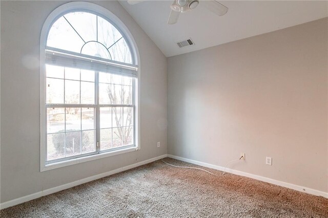 unfurnished room with ceiling fan, lofted ceiling, and carpet floors