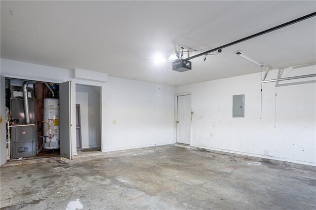 garage featuring heating unit, a garage door opener, electric panel, and water heater