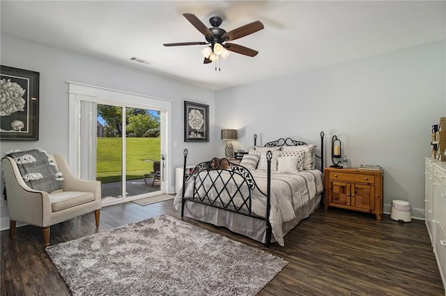 bedroom featuring ceiling fan, access to exterior, and dark wood-type flooring