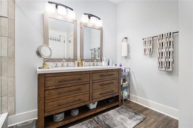 bathroom featuring vanity and hardwood / wood-style flooring