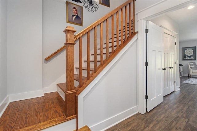 stairway featuring hardwood / wood-style flooring