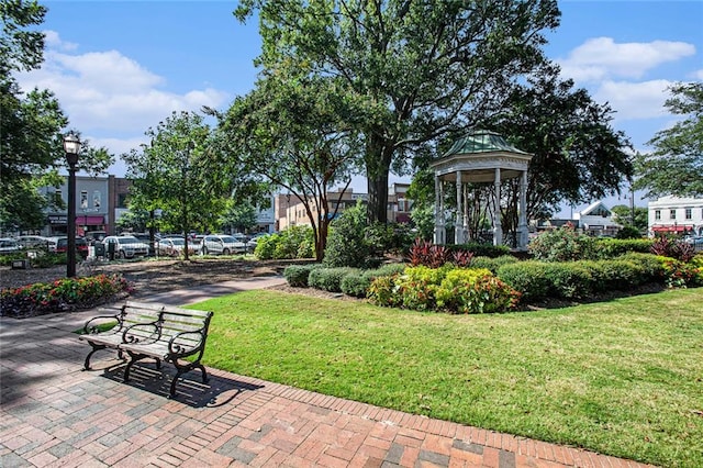 view of property's community featuring a gazebo and a lawn