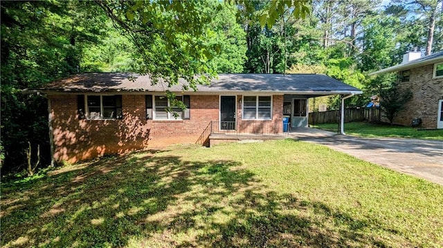 2569 Dobbs Dr NW, Kennesaw, GA 30152 - ranch-style house with concrete driveway, brick siding, and a carport