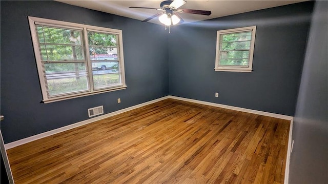 2569 Dobbs Dr NW, Kennesaw, GA 30152 - spare room featuring wood finished floors, ceiling fan, and baseboards