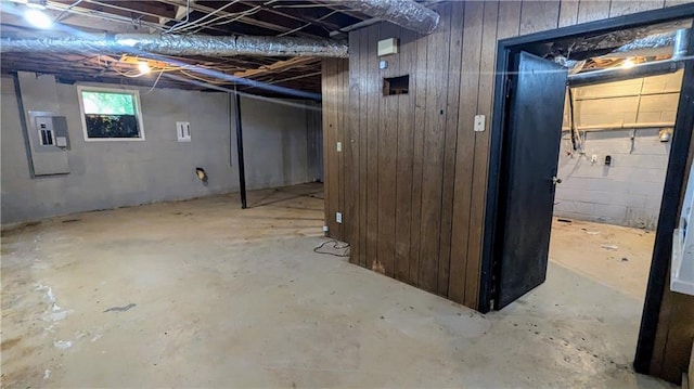 2569 Dobbs Dr NW, Kennesaw, GA 30152 - basement featuring electric panel and wooden walls