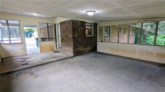 2569 Dobbs Dr NW, Kennesaw, GA 30152 - spare room with healthy amount of natural light and concrete floors