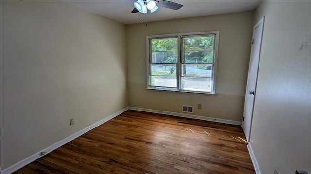 2569 Dobbs Dr NW, Kennesaw, GA 30152 - empty room with a ceiling fan, dark wood-style flooring, and baseboards