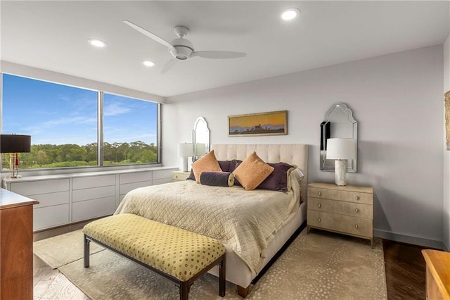 bedroom with recessed lighting, ceiling fan, and wood finished floors