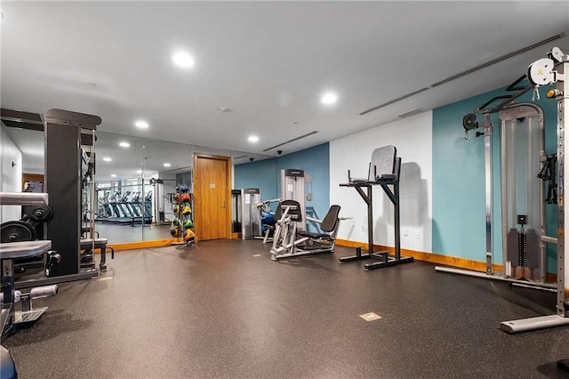 workout area featuring baseboards, recessed lighting, and visible vents