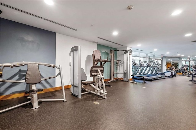 exercise room featuring recessed lighting and baseboards
