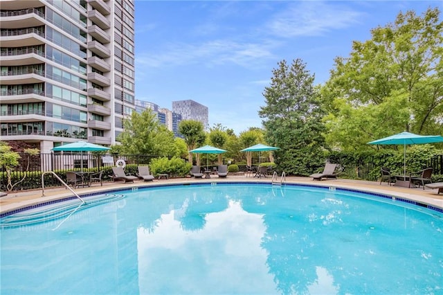 community pool featuring fence