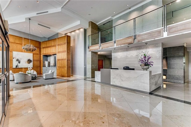 reception area featuring an inviting chandelier