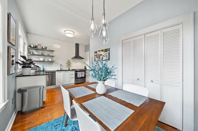 dining area featuring light wood-style flooring