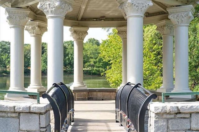 view of patio / terrace with a gazebo and a water view