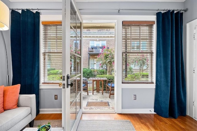 entryway featuring wood finished floors and baseboards