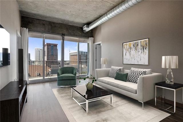943 Peachtree St NE Unit 1010, Atlanta, GA 30309 - living room with wood finished floors and a city view