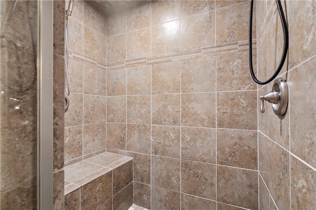 bathroom featuring tiled shower