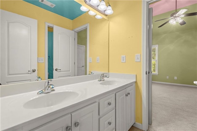 bathroom featuring ceiling fan and vanity