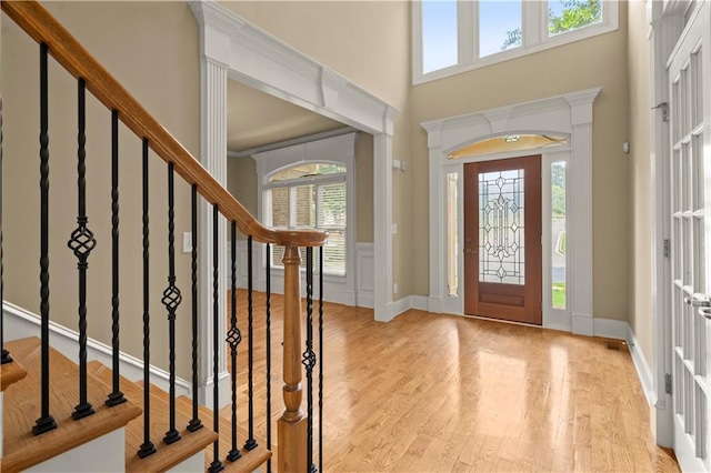 entryway with light hardwood / wood-style floors and plenty of natural light