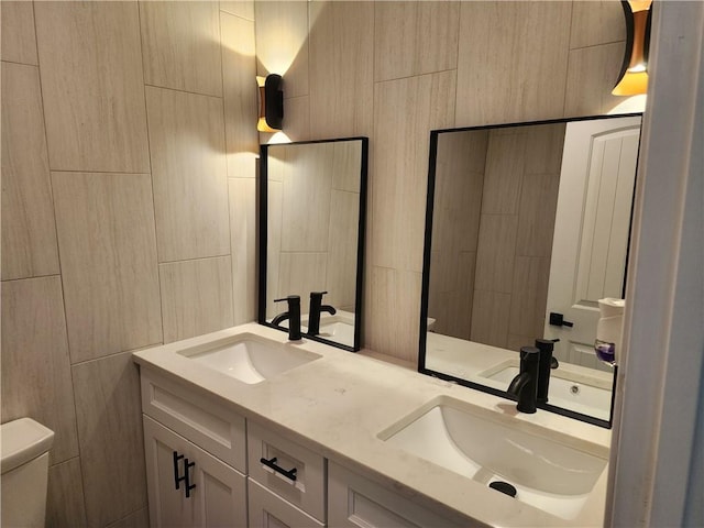 bathroom featuring toilet and vanity