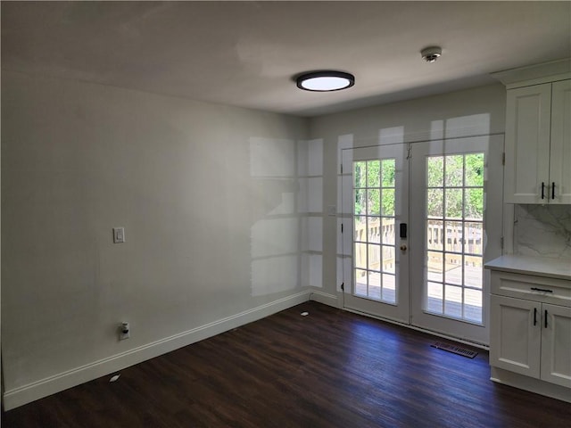 doorway to outside featuring french doors and dark hardwood / wood-style floors