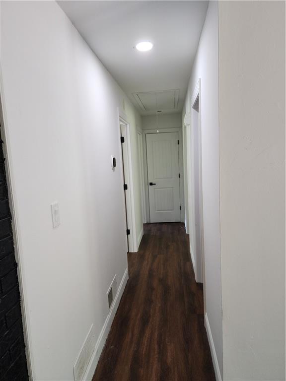 hall featuring dark hardwood / wood-style floors