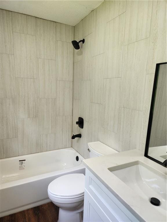 full bathroom with shower / tub combination, hardwood / wood-style flooring, vanity, and toilet