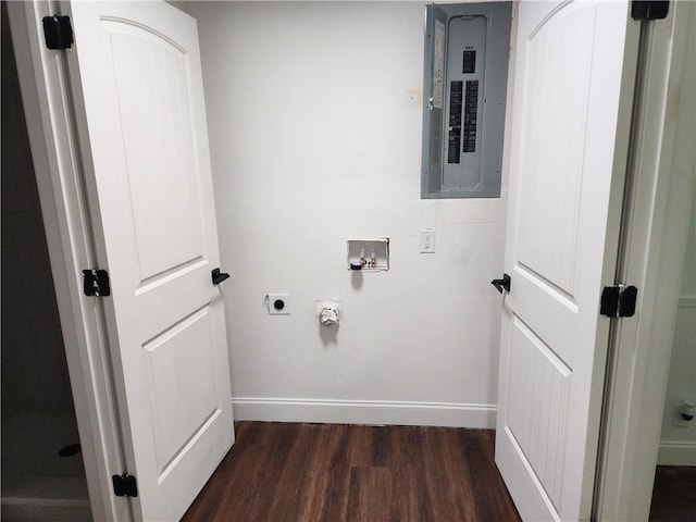 washroom with electric panel, dark hardwood / wood-style flooring, hookup for a washing machine, and hookup for an electric dryer