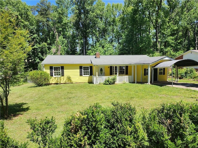 single story home featuring covered porch and a front lawn