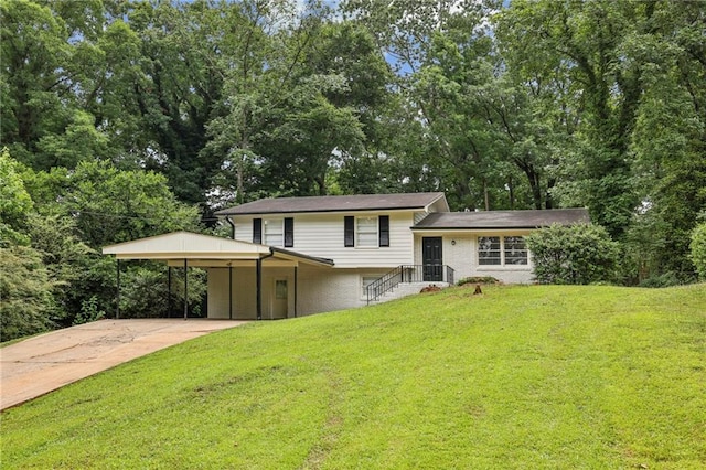 tri-level home featuring a carport and a front yard