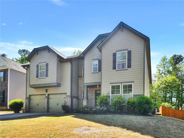 view of front facade featuring fence, driveway, a front yard, and a garage