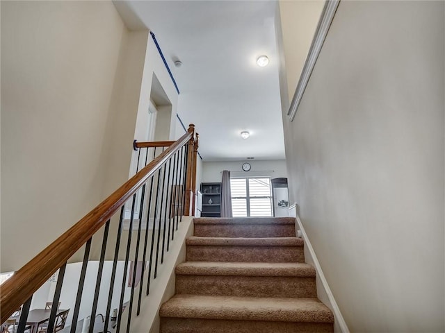 stairs featuring baseboards