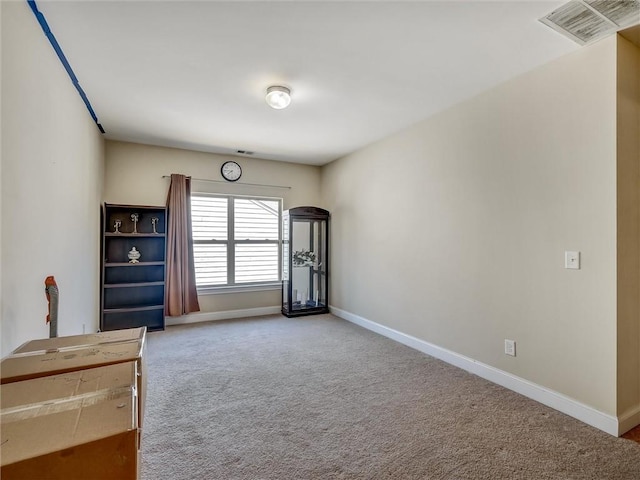 interior space featuring carpet, visible vents, and baseboards