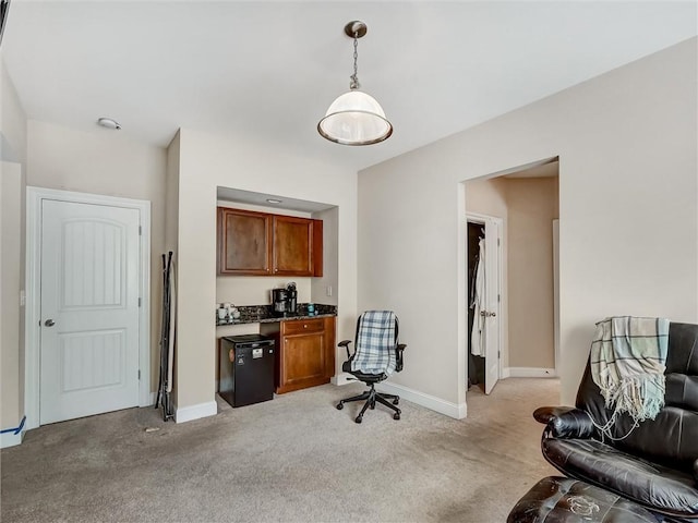 office area with baseboards and light colored carpet