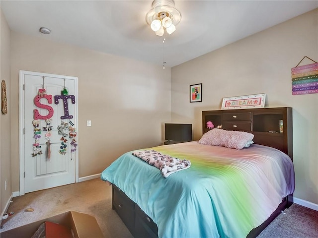 bedroom with carpet floors, baseboards, and ceiling fan