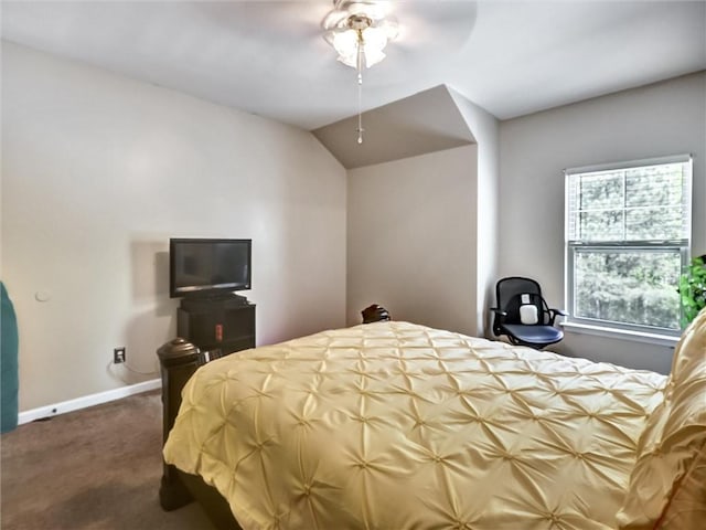 bedroom featuring lofted ceiling, a ceiling fan, baseboards, and carpet floors