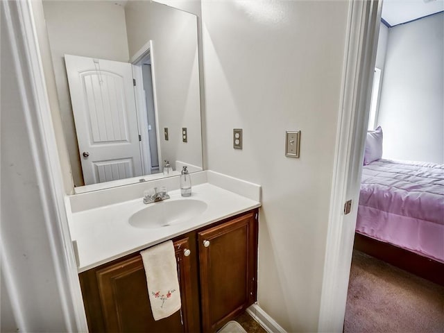 ensuite bathroom with vanity and connected bathroom
