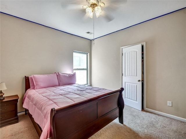 bedroom featuring ceiling fan, baseboards, visible vents, and carpet